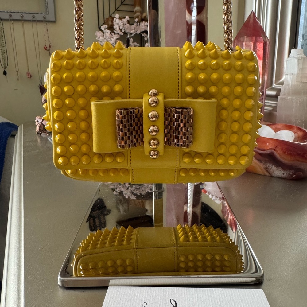 Christian Louboutin Sweet Charity Mini
Spiked Shoulder Bag in Yellow